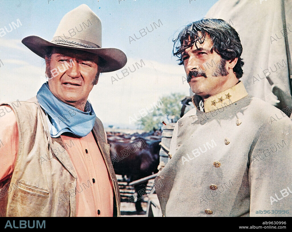 JOHN WAYNE and ROCK HUDSON in THE UNDEFEATED, 1969, directed by ANDREW V. MCLAGLEN. Copyright 20TH CENTURY FOX.