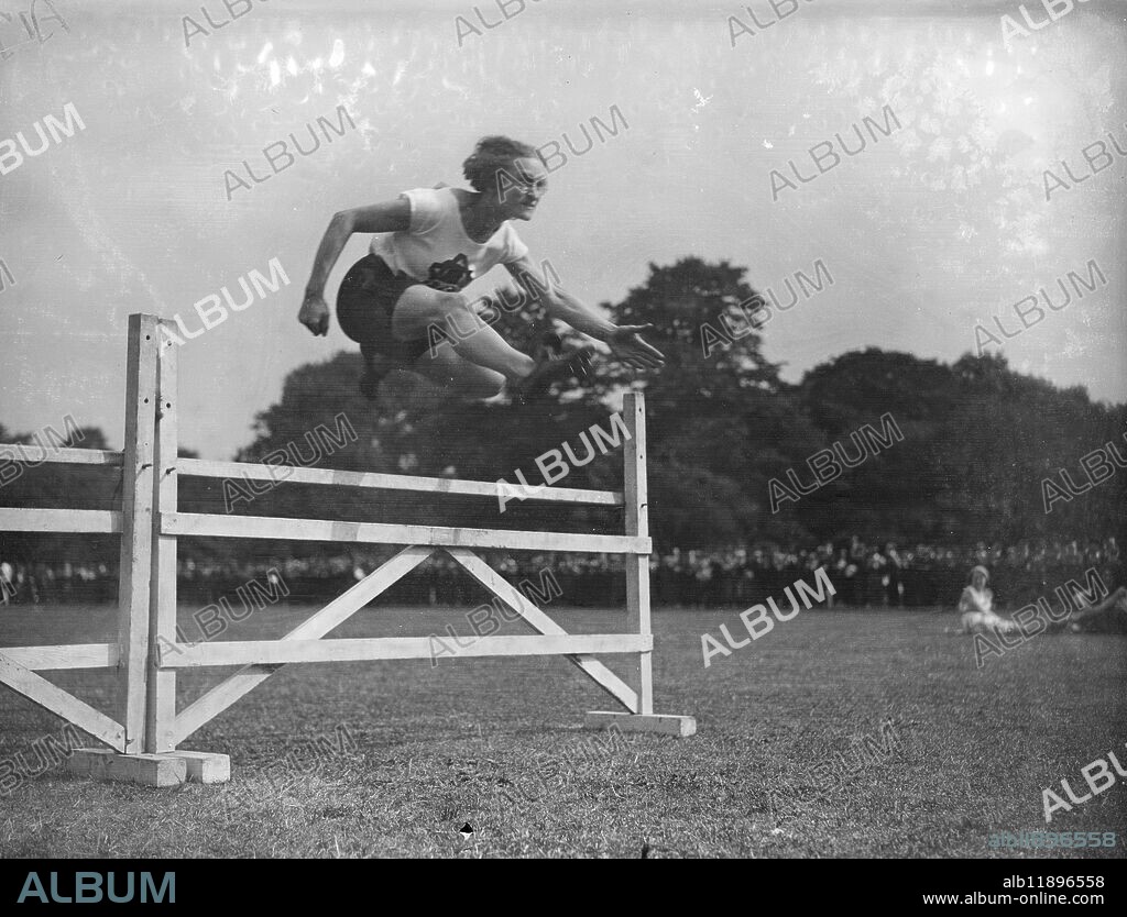 Miss D Birch wins hurdles in Polutechnic Ladies championships at Battersea Park . Miss D Birch won the 80 metres hurdles championship , at the Polytechnic ladies Athletic Club meeting at Battersea Park , London . Miss D Birch winning the hurdles at the championships. 16 July 1932.