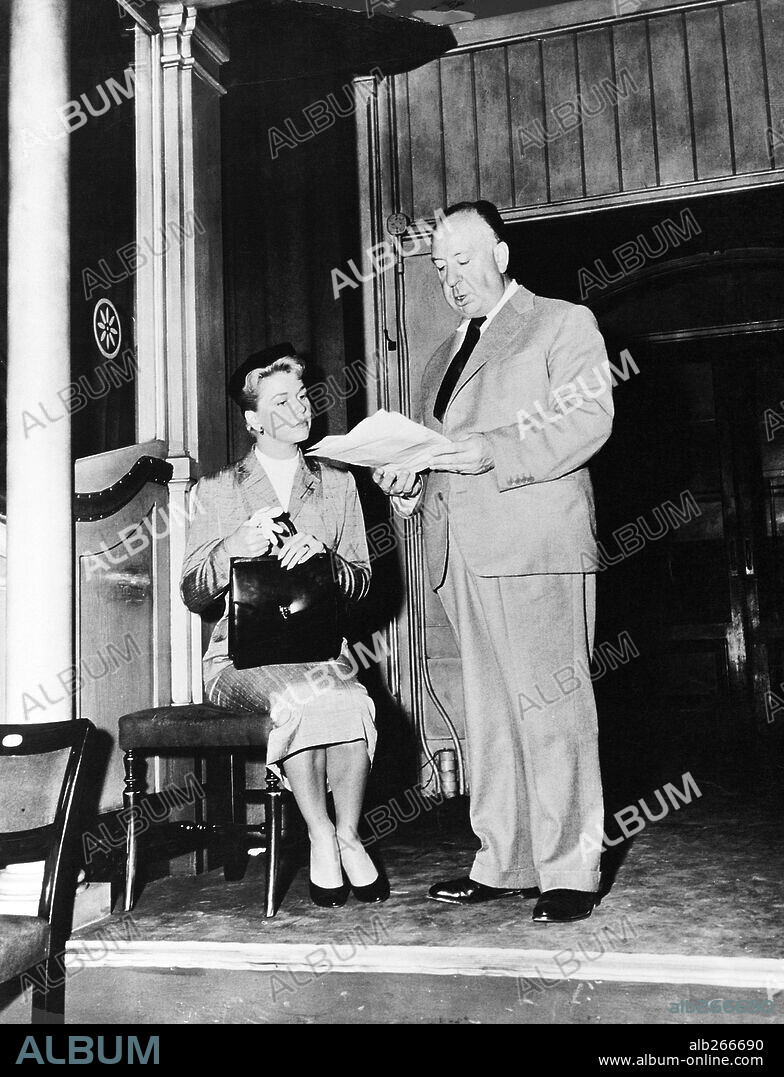 ALFRED HITCHCOCK and DORIS DAY in THE MAN WHO KNEW TOO MUCH, 1956, directed by ALFRED HITCHCOCK. Copyright PARAMOUNT PICTURES.