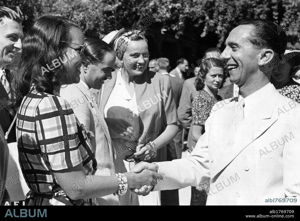 Joseph Goebbels with Elli Parvo and Alessandro Pavolini. Reich Minister of Propaganda Joseph Goebbels shaking hands with the Italian actress Elli Parvo at the presence of the Italian Minister of Culture Alessandro Pavolini during the 9th Venice International Film Festival. Venice, 2nd September 1941.