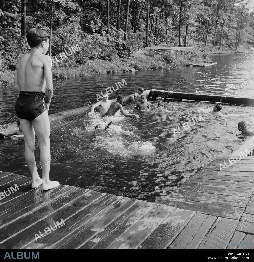 GORDON PARKS. Southfields, New York. Interracial activities at Camp Nathan Hale, where children are aided by the Methodist Camp Service. The crib, a shallow swimming pool for learners.