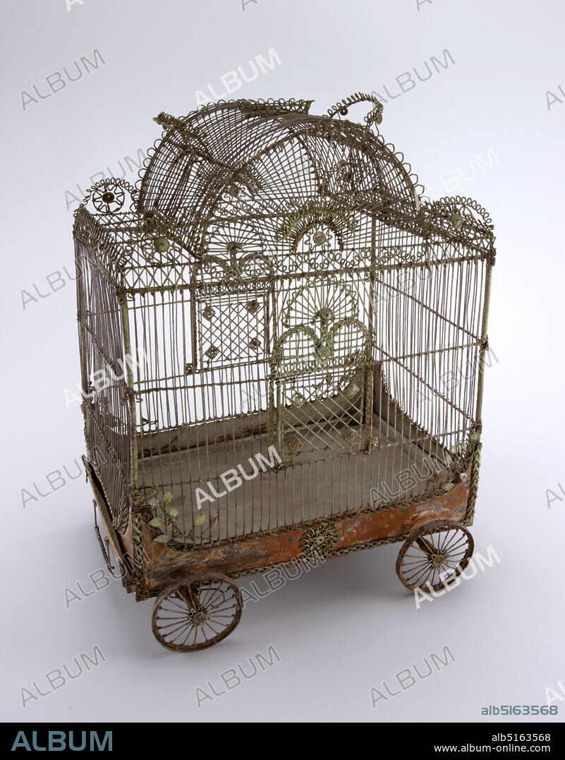 Bird cage in the form of a circus wagon, Painted metal wire, sheet metal, In the shape of a circus wagon, on four wheels with axles; central portion of roof arched, door and handle on each side of arch, shallow crown-like decoration and handle at top of arch; doors on long sides of cage; pull-out pan with handle on bottom of cage; decorated with looped, braided and coiled wire and tiny metal leaves., France, 18th century, metalwork, Decorative Arts, Birdcage, Birdcage.