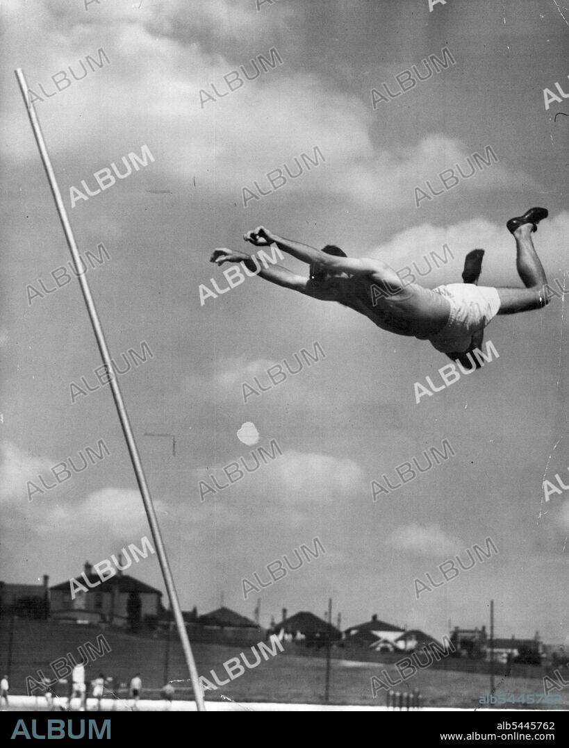 Pole Vaulting is an art and Mullins has good technique. He's in the top flight, but not quite a champion. Caught in the air in the hop, step and jump. May 31, 1948.