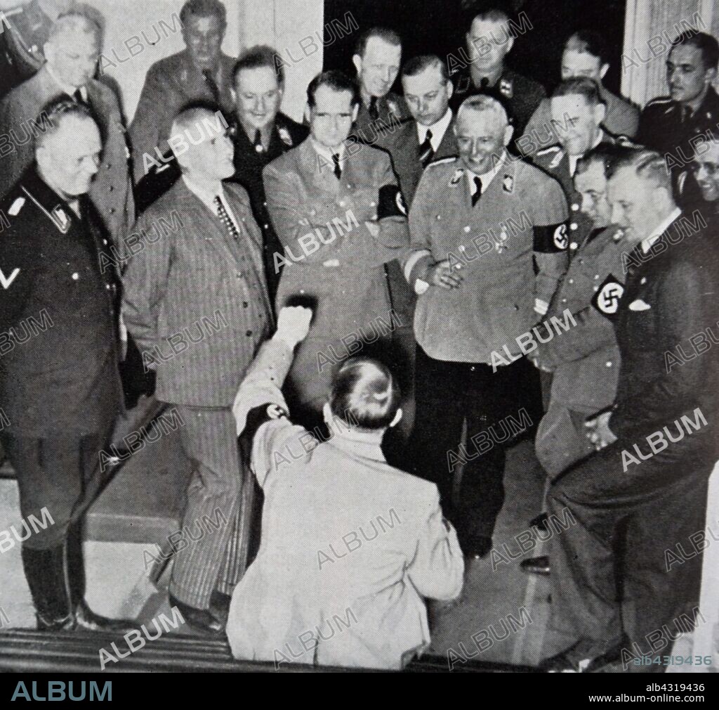 Adolf Hitler German chancellor 1933 - 1945 (seated) with Nazi leaders including Rudolf Hess, Robert Ley and Martin Bormann 1936.