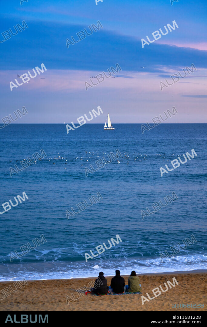 Sunset at Barceloneta Beach, Barcelona, Catalonia, Spain.