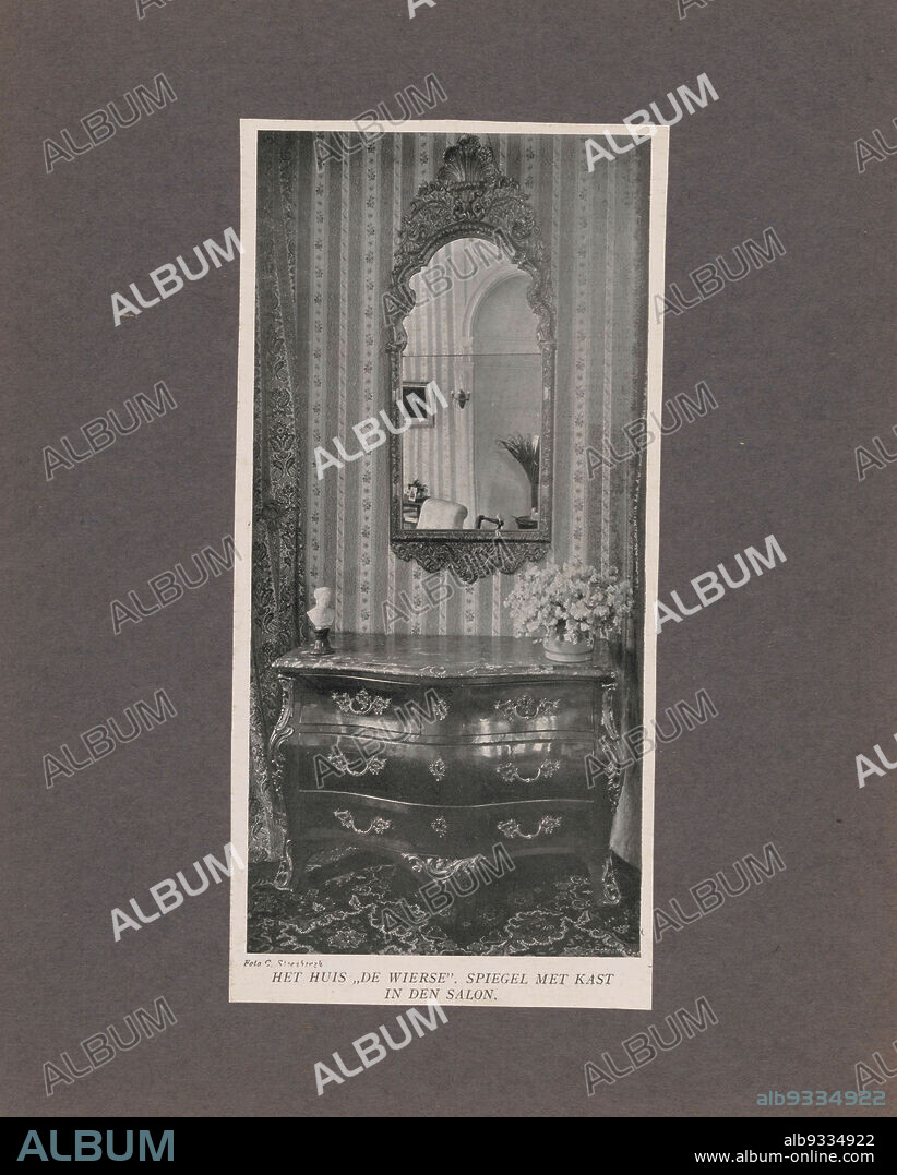 Interior of De Wiersse Castle in Vorden with a mirror and sideboard, THE HOUSE ,,DE WIERSE. MIRROR WITH CABINET IN THE DRAWING ROOM. (title on object), C. Steenbergh (mentioned on object), Vorden, c. 1885 - c. 1900, cardboard, paper, height 180 mm × width 136 mm.