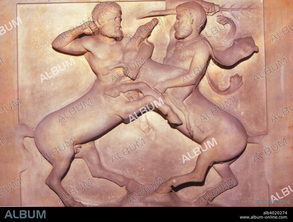 Two Centaurs Fighting over a Young Deer, Late 5th century BC. (20th century). Detail from  end panel of Lycian Sarcophagus from the Royal Necropolis, Sidon. A centaur is the mythological creature with a creature with the upper body of a human and the lower body of a horse.