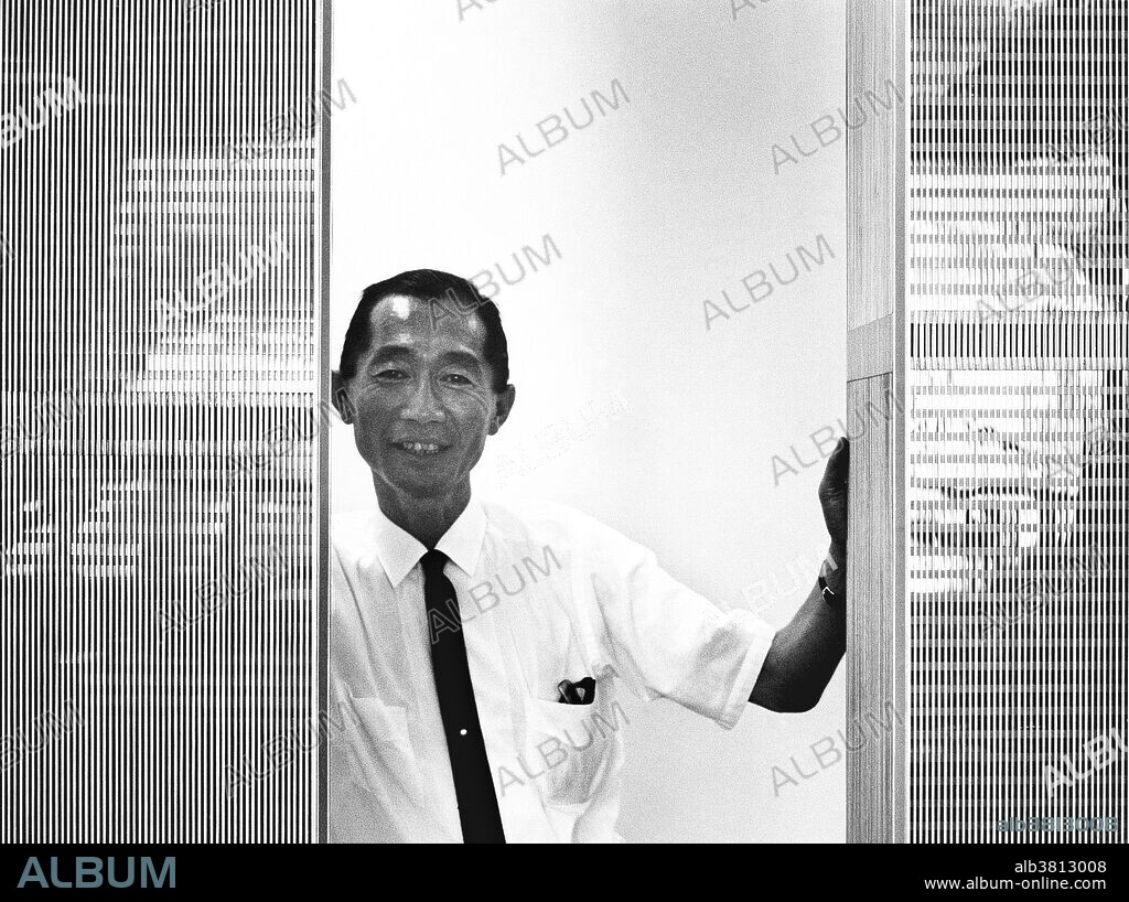 Minoru Yamasaki (1912-1986), US architect, with a model of the Twin Towers of the World Trade Center. Yamasaki, born in Seattle, USA, to Japanese parents, became one of the leading architects of the second half of the 20th century. A practitioner of the style called 'New Formalism', his designs include the Pacific Science Center, Seattle, the Torre Picasso, Madrid, Spain, and the Twin Towers, New York, USA. The design of the latter began in 1965, and construction took place from 1966 to 1972. The tallest buildings in the world (417 metres) from 1972 to 1974, they were destroyed in the terrorist attack of 11 September 2001.