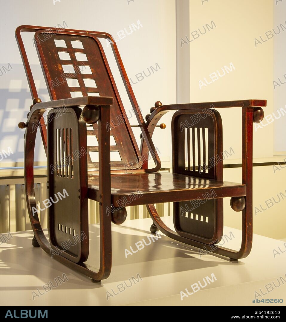 Chair designed by Josef Hoffmann  'Sitzmachine'.  Made by Jacob u. Josef Kohn, Wien um 1905 (2018) .  Geometric patterns with reclining backrest and armrests.