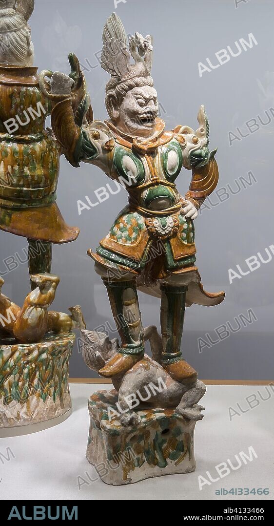 Armored Guardian King (Tianwang) Trampling Demon. China. Date: 701 AD-750 AD. Dimensions: H. 37 in. Earthenware with three-color (sancai) lead glazes and traces of pigments. Origin: China.