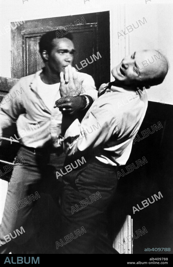 DUANE JONES and KARL HARDMAN in NIGHT OF THE LIVING DEAD, 1968, directed by GEORGE A. ROMERO. Copyright MARKET SQUARE PRODUCTIONS.