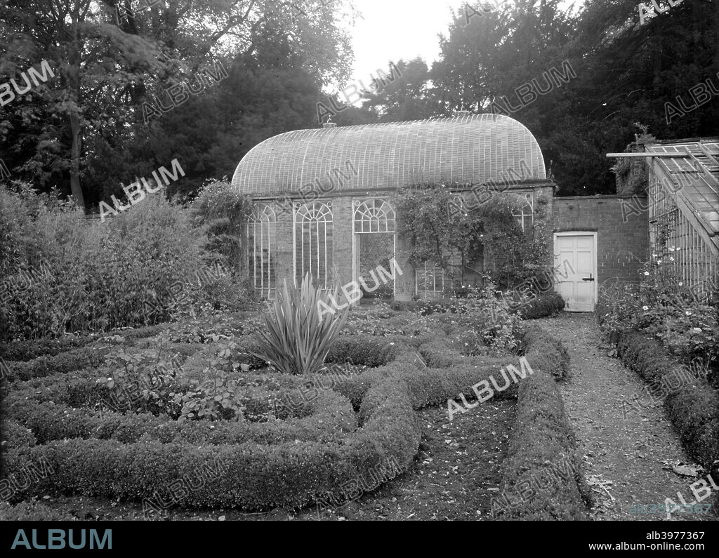 The orangery in the gardens at Howsham Hall, North Yorkshire, 1953. The grounds were landscaped by Nathaniel Chomley in the eighteenth century. A number of houses in the village were demolished so that the land on which they stood could be incorporated into the park.