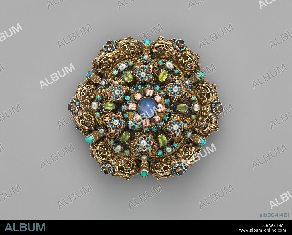 Dress ornament (heftel). Culture: Hungarian. Dimensions: Diameter: 5 in. (12.7 cm). Date: 18th century, with later alterations.
Dress ornaments were the height of fashion for Saxon women in Transylvania. They were originally worn as bodice clasps, but as rich women demanded larger and heavier examples so as to display their wealth, these pieces were also sometimes suspended from a cloth band around the neck. This object is among the few Hungarian goldsmith pieces that the Museum had before the gift of the Salgo Collection.
