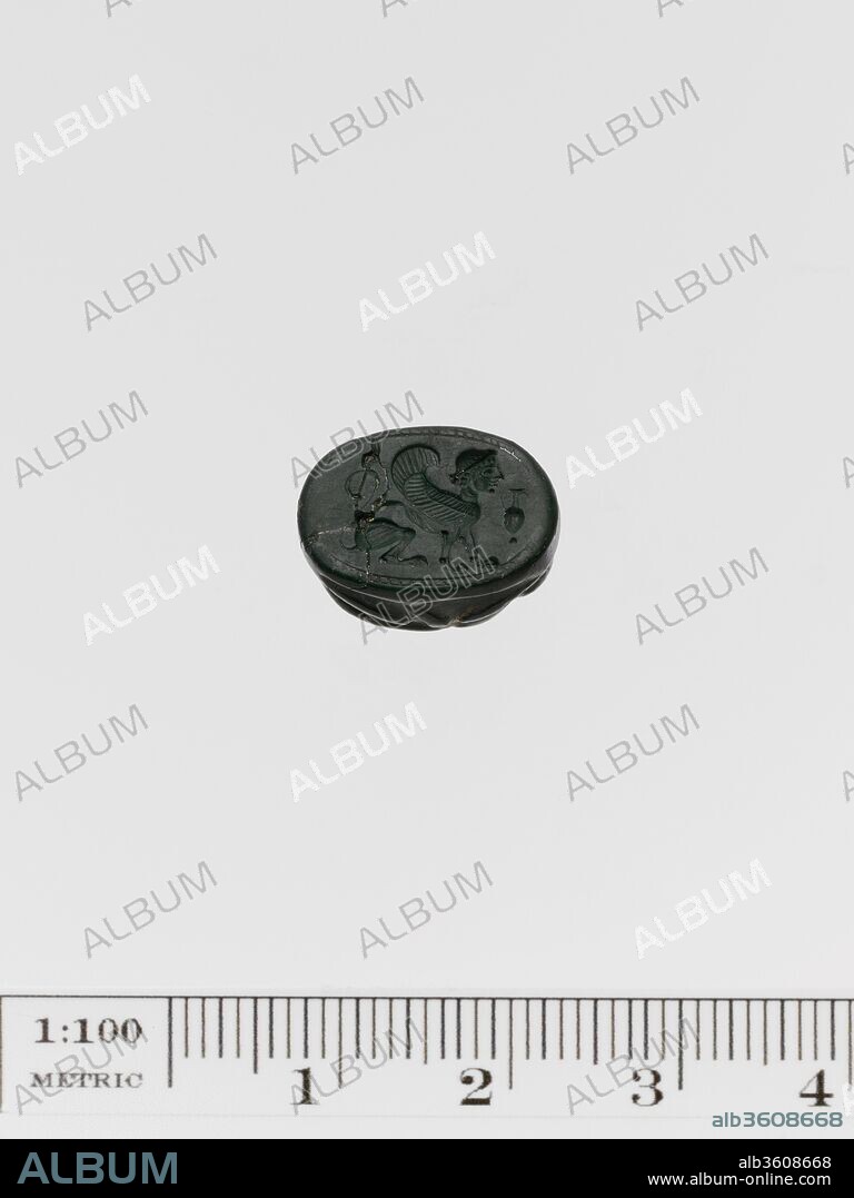Jasper scarab. Culture: Greek. Dimensions: Length: 9/16 in. (1.5 cm). Date: 6th-5th century B.C..
Crouching sphinx; in the field is a pointed amphora.