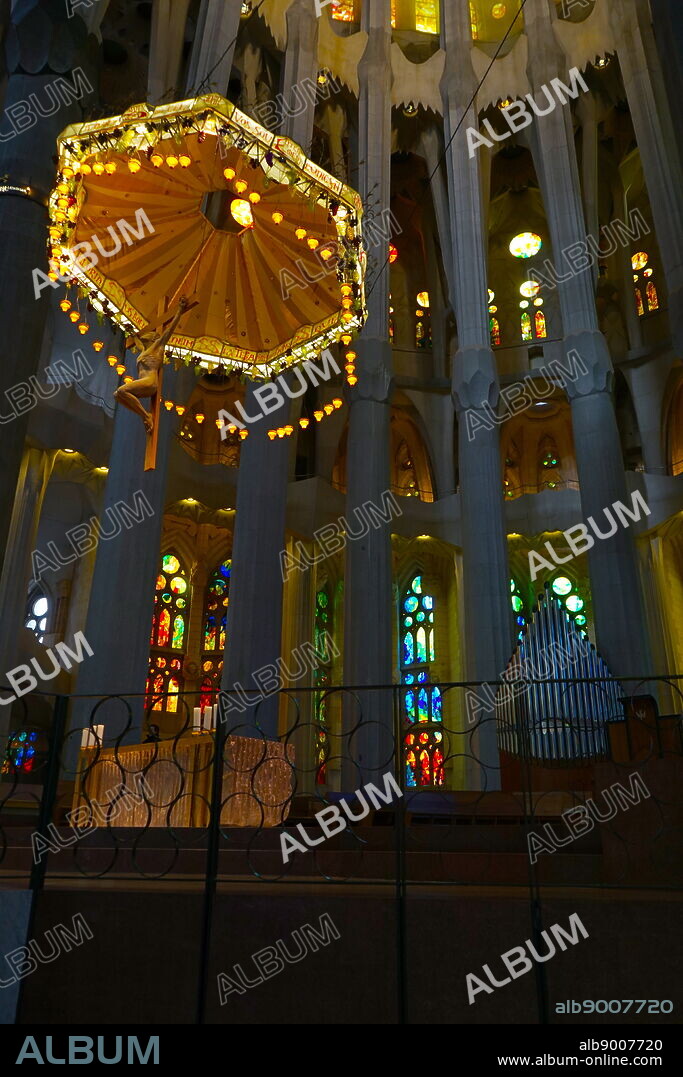 View of the suspended crucifix and glass altar within the Basílica i Temple Expiatori de la Sagrada Família, a Roman Catholic church in Barcelona, designed by Spanish architect Antoni Gaudí (18521926). Dated 21st Century.