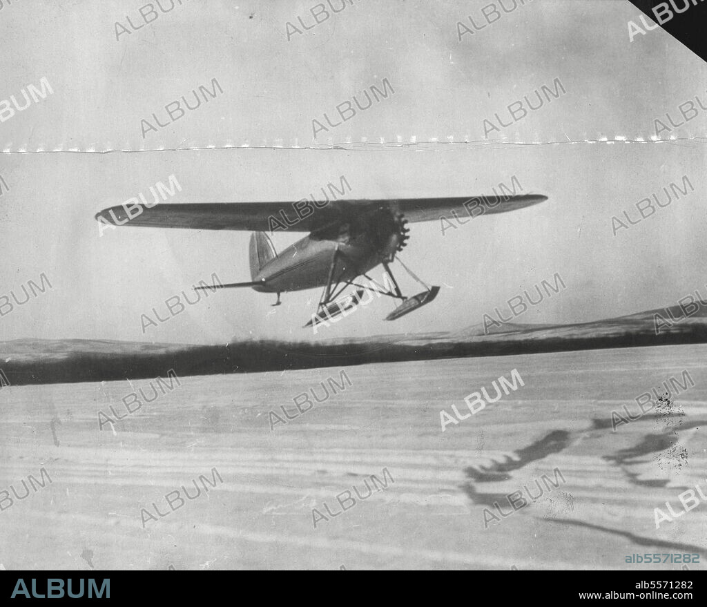 Capt. Wilkins Flies Across The North Pole -- The Lockheed-Vega Monoplane taking off from Fairbanks Alaska, with Capt. George H. Wilkins and Lt. Eleson in the cockpit, on their first leg of flight across the North Pole. It became known that they flew from point barrow and landed at Baldmansocira Island in the Arctic Zone. Remained on the Island five days and hopped again landing at Salford, Denmark. June 24, 1928. (Photo by M-G-M News).