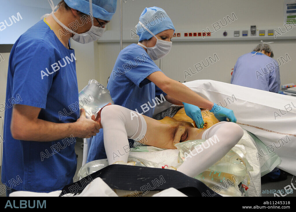 Photo essay at Lyon hospital. Department of urology. Phalloplastie, operation of plastic surgery to create a phallus, required to complete a change of sex, following a hystéro-ovariectomie.This takes place in two steps. Here step 2. Step 1: it's the creation of a neo-penis from a fragment of skin taken from the arm. The skin, the nerves, the veins and the arteries are taken from the not dominant arm to constitute the urethra, the acorn and the penis. The vaginal cavity is blocked and the big lips are used for the scrotum. The nerves which innervate the clitoris are protected, they will innervate the penis, in order to keep an orgasmic capacity after the intervention. Step 2: after the penis found its sensibility, testiculaires implants and implant are added to make an erection possible on demand. Here, asepsis.