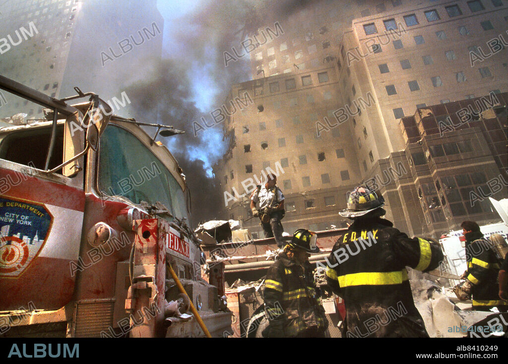 New York City Fire Fighters amid debris with smoldering ruins in background, Terrorist Attack on World Trade Center, New York City, New York, USA, Unidentified Artist, September 11, 2001.