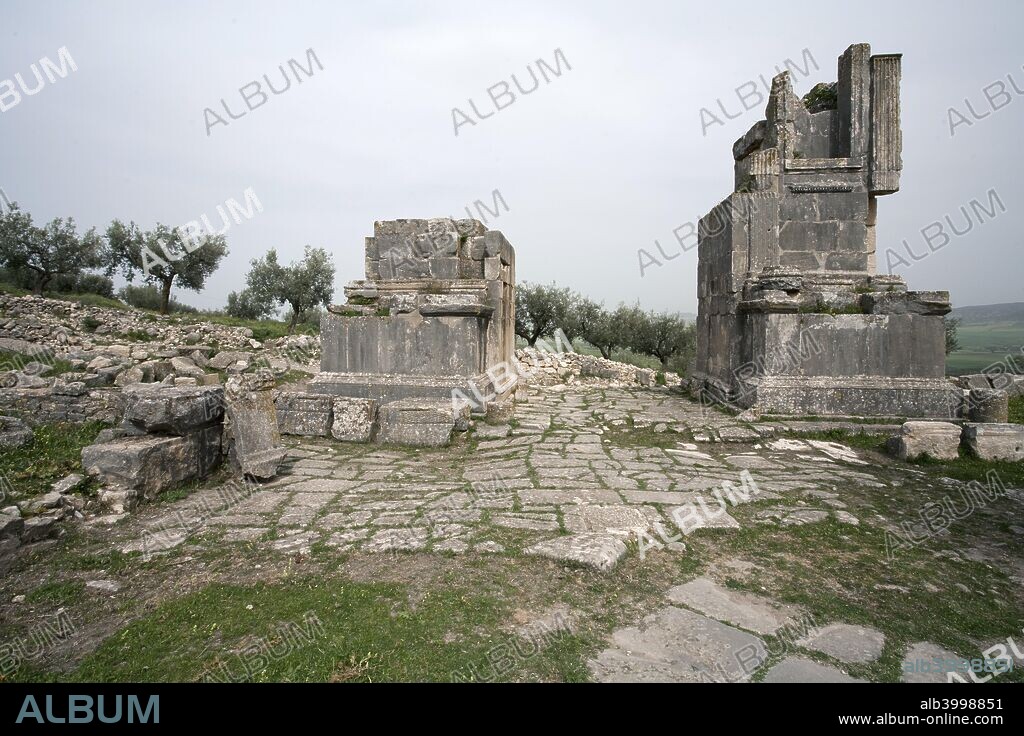 The Arch of Septimius Severus, Dougga (Thugga), Tunisia. The Arch of Septimius Severus (5m/16ft wide) was erected in AD 205 to mark the town's promotion to the status of municipium, which carried with it the right to its own constitution, administration and civic law. The arch leads onto the road from Carthage to Theveste.