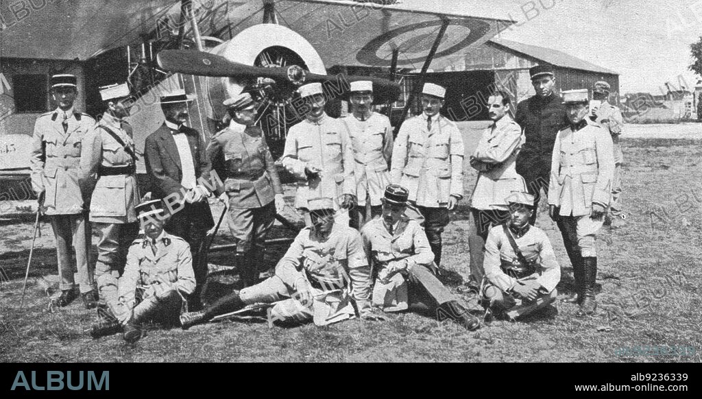 'Aviateurs; Une visite de Gabriele d'Annunzio aux aviateurs francais de Venise: le poete, ayant a sa droite le consul de France, est entoure des pilotes de l'escadrille de chasse de Nieuport', 1916. From "Collection de la Guerre IV. L'Illustration Tome CXLVIII. La Guerre Juillet, Aout, Septembre, Octobre, Novembre, Decembre 1916".