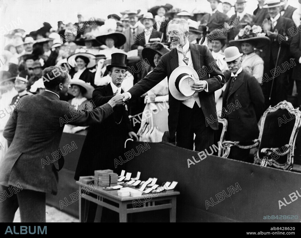 FILE 1912. Price-ceremony for tennis at the olympics in Stockholm 1912.. Prince between of King Gustaf V and the winner, Frenchman André Gobert, gold medalist Men's singles indoor, during an award ceremony in tennis at the Olympic Games in Stockholm.. Foto:Scanpix Historical/ Kod:1900. Scanpix SWEDEN.