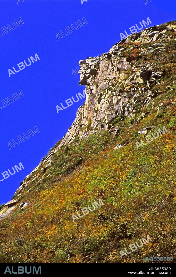 The former state symbol of New Hampshire, "The Old Man of the Mountain", was a rock formation on a shoulder of Profile Mountain, twelve hundred feet above Profile Lake in the Franconia Notch. It was composed of five layers of Conway red granite; one formed the chin, another the upper lip, a third the nose and two layers comprised the forehead. The brutal winters of 2002 and 2003 contributed to the demise of "The Old Man of the Mountain".