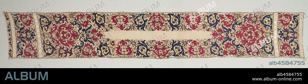Headkerchief, 1700s. This beautiful kerchief, worn wrapped around the head, was part of elegant bathing equipment that well-to-do women wore while relaxing in a hammam after bathing. The floral and foliate embroidery reflect a fashion that lasted for more than a century. This example is dominated by brilliant crimson and blue silk stitches.