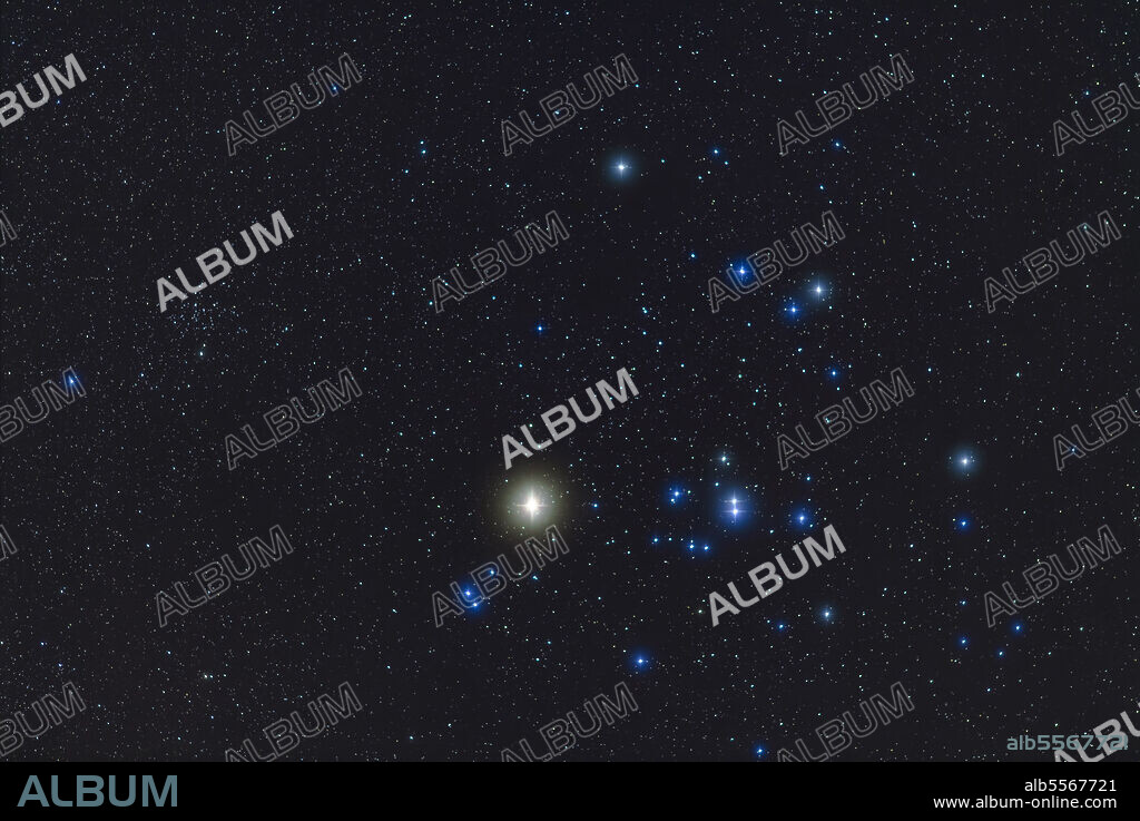 The Hyades star cluster, with bright yellow Aldebaran, in Taurus, with the smaller, more distant star cluster NGC 1647 at left. The field is similar to that of binoculars.