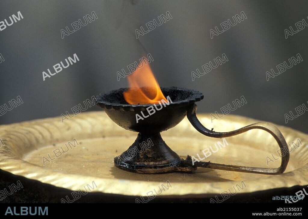 Jain sacred fire at the feet of the giant statue of Gomateshwara at Shravanabelagola.