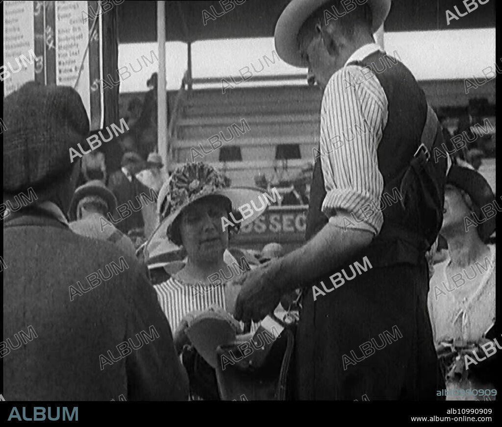 A Female Civilian Placing a Bet with a Bookie in a Horse Racing Event, 1920s. From "Time to Remember - Teenage Flapper", 1920s (Reel 3); a dcumentary about women's lives in the 1920s - great commentary by Joyce Grenfell.
