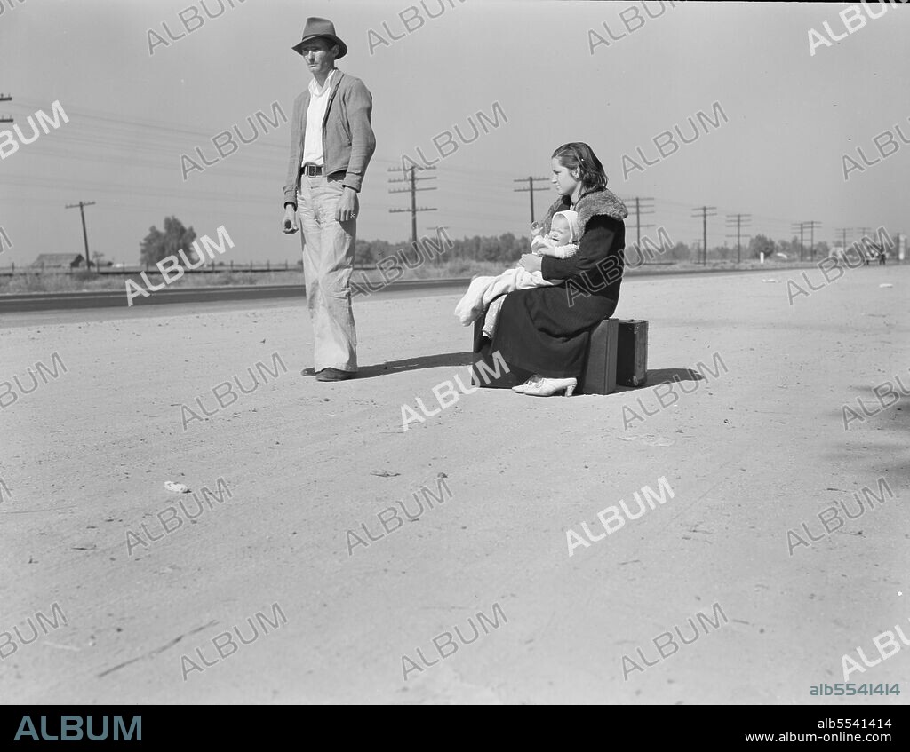 DOROTHEA LANGE. Young family, penniless, hitchhiking on U.S. Highway 99, California. The father, twenty-four, and the mother, seventeen, came from Winston-Salem, North Carolina, early in 1935. Their baby was born in the Imperial Valley, California, where they were working as field laborers.