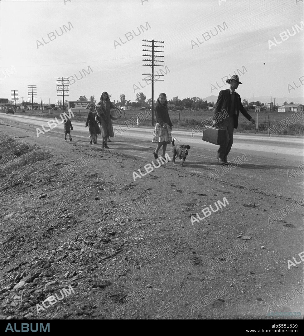 DOROTHEA LANGE. On U.S. 99. Near Brawley, Imperial County. Homeless family of seven, walking the highway from Phoenix, Arizona, where they picked cotton. Bound for San Diego, where the father hopes to get on the relief because he once lived there.
