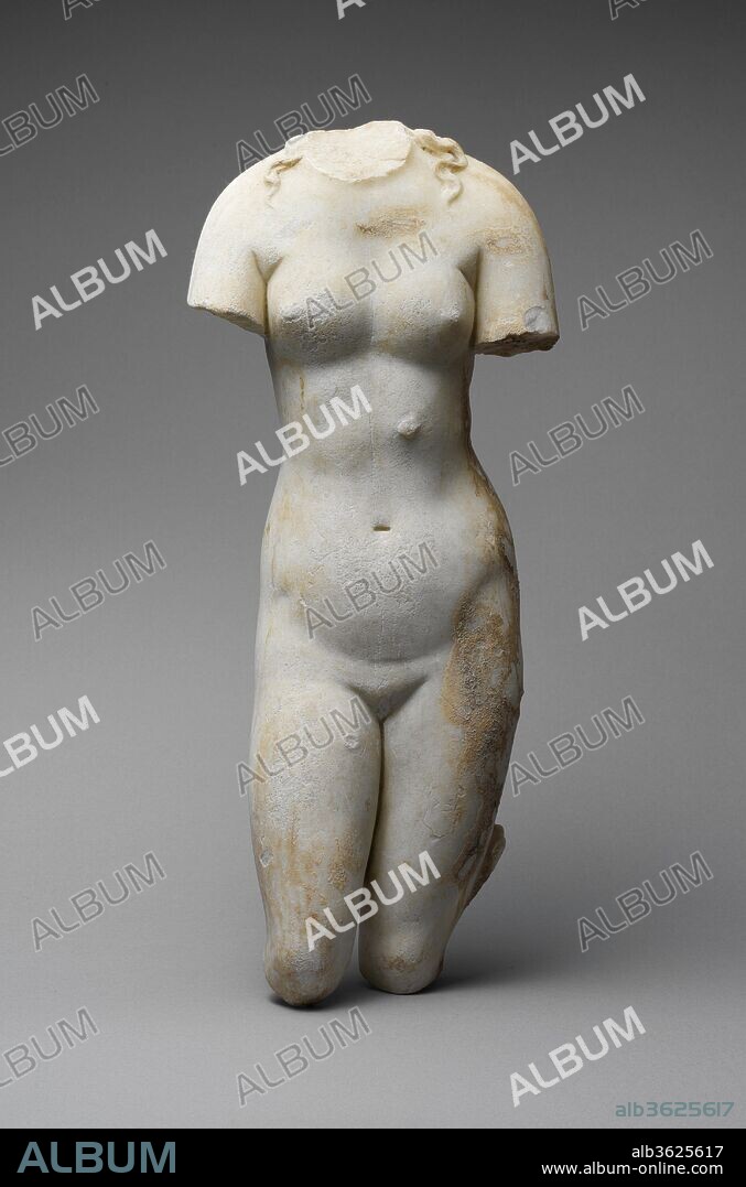 Marble statue of Aphrodite. Culture: Roman. Dimensions: H. 16 5/8 in. (42.2 cm). Date: 1st or 2nd century A.D..
Small-scale adaptation of a Greek statue type of the 3rd or 2nd century B.C.
Aphrodite brought her hands forward to partially conceal her breasts and pubic area in this version of a statue type that is known today as the Capitoline Aphrodite.