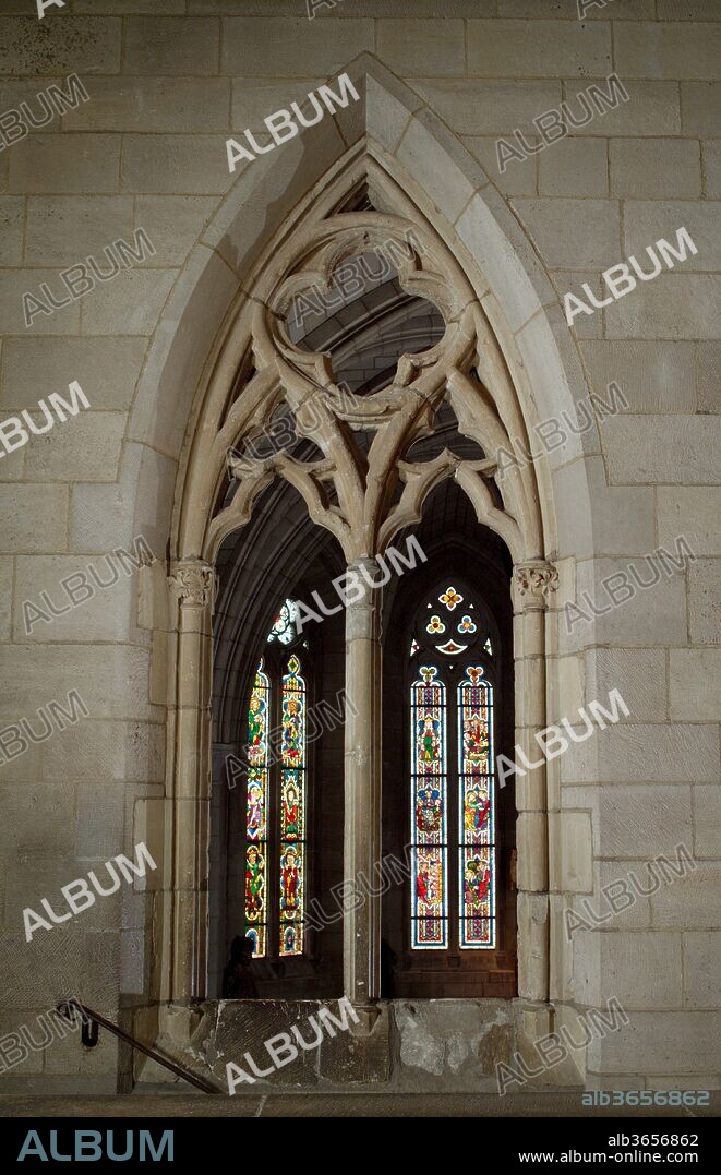 Double-Lancet Window. Culture: French. Dimensions: Overall: 13 ft. 6 in. x 7 ft. 5/8 in. (411.5 x 214.9 cm). Date: ca. 1275-1300.
This limestone window from La Tricherie, a small village near Châtellerault (between Tours and Poitiers), is constructed in a style typical of the late thirteenth century. The overall opening is organized into two identical lancets topped by a circle (oculus), which circumscribes a quatrefoil--a basic scheme that first appeared in window designs in the late twelfth century. In this version new elements have been introduced, such as trefoils composed of pointed, rather than rounded, leaf forms. The desire to create a diaphanous effect is evident in the piercing of the remaining surfaces between traceries, which leaves no solid fields in the skeletal structure. Small capitals decorate the vertical members (mullions) of the inscribed lancets. On the interior face the capitals are carved with broad, flattened leaves; on the exterior face the outer two are transformed into whimsical male and female heads.