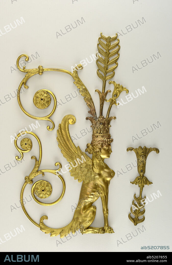 Mount, Gilt bronze, Winged female sphinx facing right with acanthus leaf crown from which springs an ancanthus-like flower, a tall symmetrically leafed and berried stem and a long spiraled leafed stem ending in a rosette. Sphinx's tail is an elongated acanthus leaf ending in a double spiraled stem, each of which terminates in a rosette. Seven screw holes and two small threaded projections under feet for attachment to wood. End broken off center stem projecting from crown., ca. 1805, Decorative Arts, Mount.