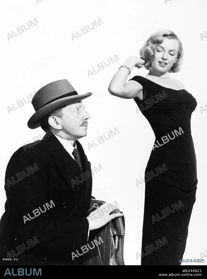NORMA JEAN BAKER y SAM JAFFE. MARILYN MONROE y SAM JAFFE en LA JUNGLA DE ASFALTO, 1950 (THE ASPHALT JUNGLE), dirigida por JOHN HUSTON. Copyright M.G.M.