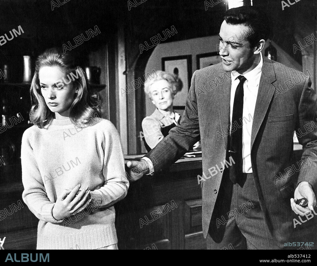 SEAN CONNERY and TIPPI HEDREN in MARNIE, 1964, directed by ALFRED HITCHCOCK. Copyright UNIVERSAL PICTURES.