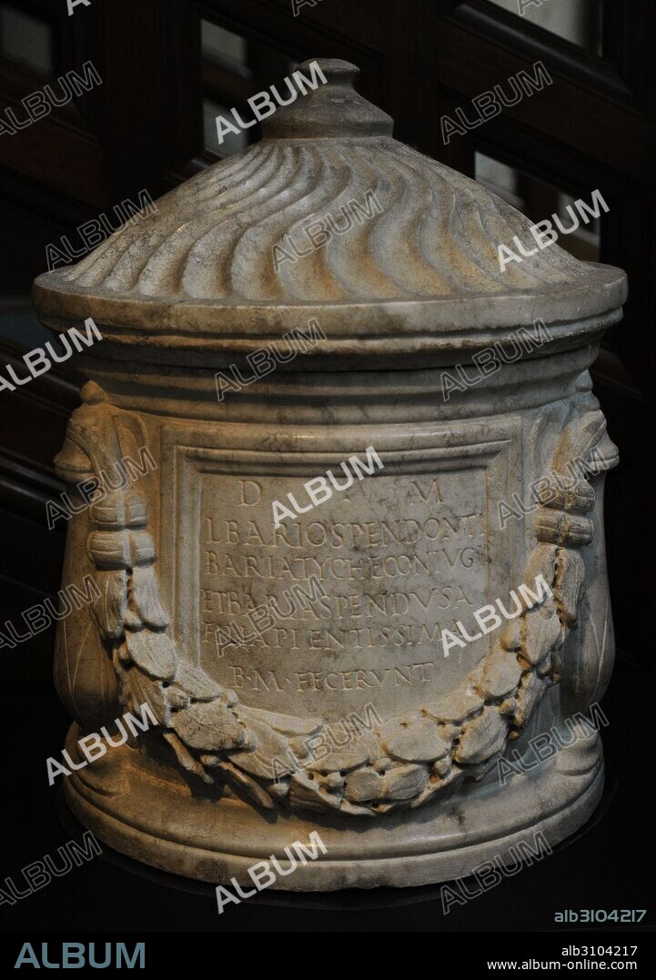 Roman cinerary urn decorated with garland of bay leaves. Latin inscription: for the spirits of the deceased Baria Tyche, with her daughter Baria Spendus, by her husband Lucius Barius Spendon. Marble. 150-200 AD. Museum of Mediterranean and Near Eastern Antiquities. Stockholm. Sweden.