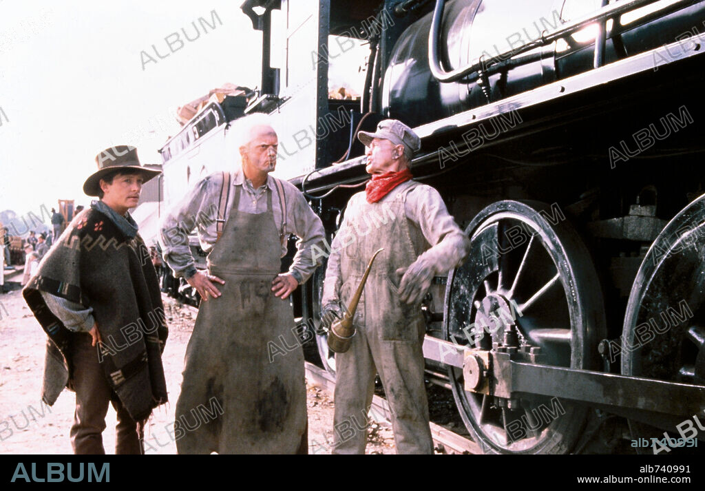 CHRISTOPHER LLOYD and MICHAEL J. FOX in BACK TO THE FUTURE PART III, 1990, directed by ROBERT ZEMECKIS. Copyright UNIVERSAL PICTURES.