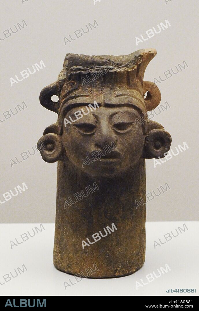 Vaso decorado con cabeza humana. Cerámica. Cultura Zapoteca (Monte Albán III). Período Clásico Temprano y Medio (100-700 d. C.). México. Museo de América. Madrid. España.