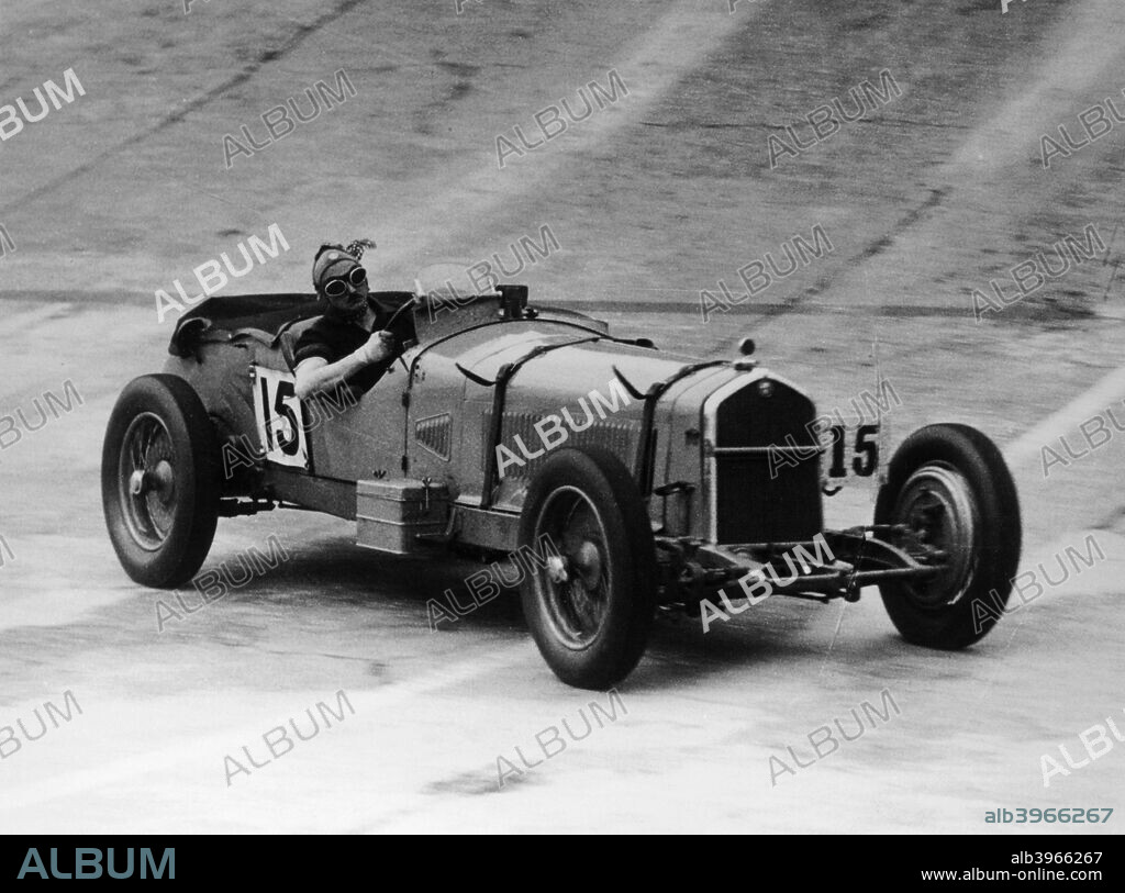 Henry Birkin in an Alfa Romeo at Brooklands, Surrey, 1930s. He was one of the group of drivers known as the Bentley Boys who drove for Bentley Motors. He won the Le Mans 24 Hours twice in 1929 and 1931. In 1931 he bought a Maserati for Grand Prix events and an Alfa Romeo for sports car racing. He won the Irish Grand Prix in the Alfa.