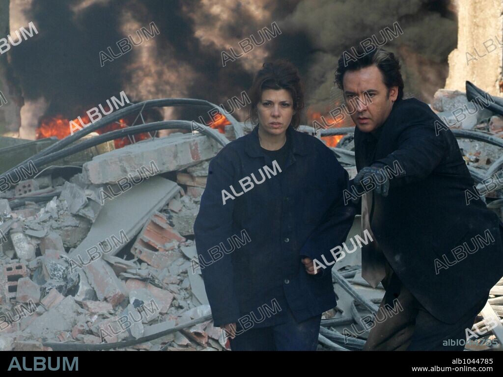 JOHN CUSACK and MARISA TOMEI in WAR, INC., 2008, directed by JOSHUA SEFTEL. Copyright NEW CRIME PRODUCTIONS/B & W FILMS/BOYANA FILM STUDIOS.