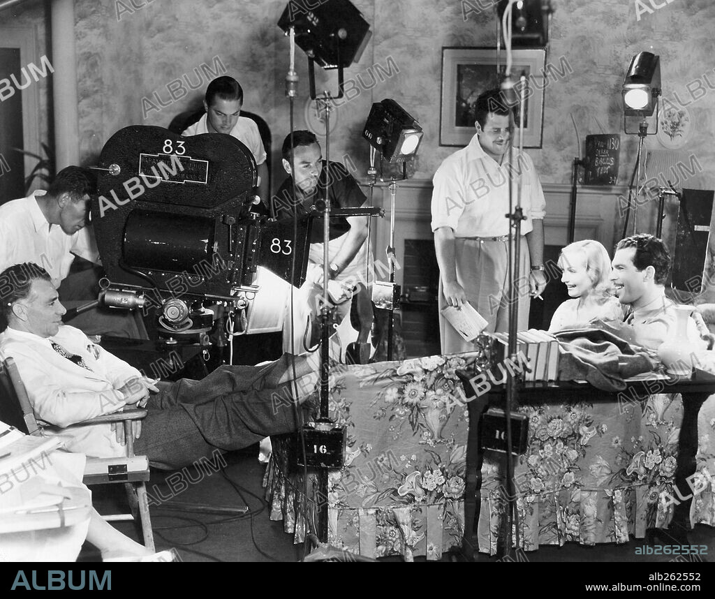CAROLE LOMBARD, FRED MACMURRAY, TED TETZLAFF and WESLEY RUGGLES in TRUE CONFESSION, 1937, directed by WESLEY RUGGLES. Copyright PARAMOUNT PICTURES.