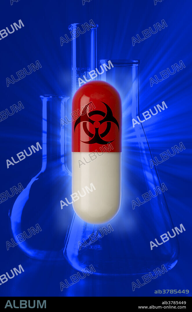Capsule with a biohazard symbol with laboratory beaker in the background.