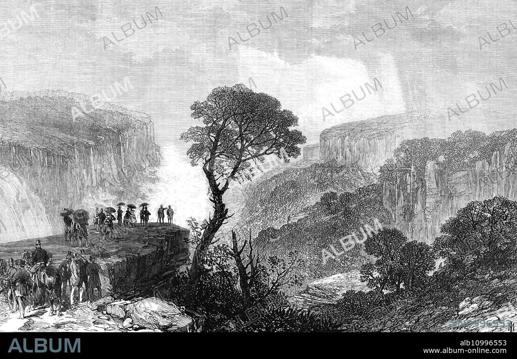 His Royal Highness the Duke of Edinburgh at the Weatherboard Waterfalls, in the Blue Mountains, New South Wales, 1868. Engraving of a sketch by Oswald Walter Brierley, '...the artist who has accompanied [Prince Alfred] all through his tour among the Southern British colonies...There is a railway from Sydney to that place, and his Royal Highness...travelled thither by a special train...Bushmen, dwelling in bark huts, and very simply clad, are the scanty population of this district. About a hundred of them, with the women, boys, and girls, were assembled at the railway station. They cheered, and waved such white handkerchiefs as they had at the ends of sticks. The Prince and his party got into six carriages, and drove to the waterfalls...The weather, unfortunately, was rainy and misty, so that the waterfalls could not be seen to great advantage. They have a depth, from ledge to ledge, of several hundred feet. The party stayed three hours, ate a substantial luncheon, and went back to Sydney in the afternoon'. From "Illustrated London News", 1868.