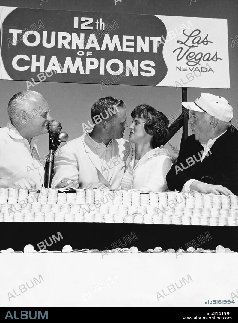 Las Vegas, Nevada: 1963. Professional golfer Jack Nicklaus kisses his wife after winning the Tournament of Champions at the Desert Inn Country Club. Desert Inn owner Wilbur Clark (L) and journalist Walter Winchell (R) are spectators.