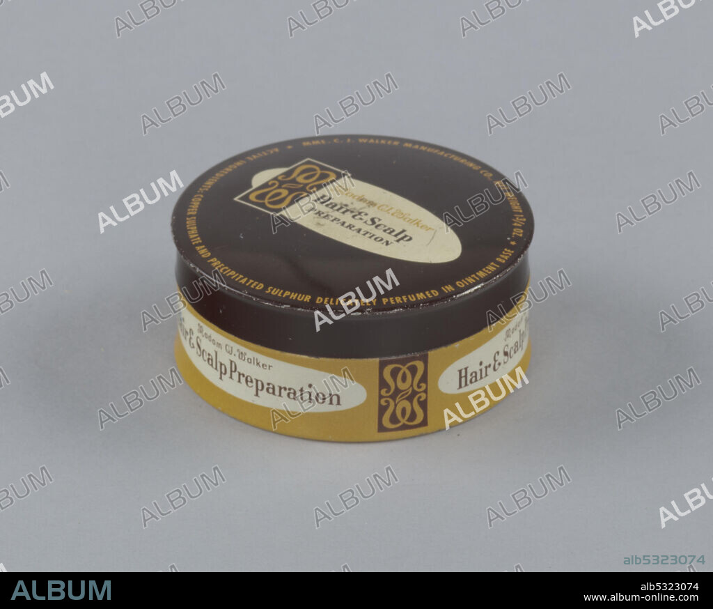 The Madam C. J. Walker Manufacturing Company, best known for its African-American cosmetics and hair care products, was founded in 1910 by Madam C. J. Walker. The company is considered to be the most widely known and financially successful African-American owned business of the early twentieth century. The canister is fitted to a lid that shares a similar color scheme with the main body of the container. The lid has a brown background with yellow text and at its center is a white oval formatted with the Madam CJ Walker logo on its left and the product name [Madam CJWalker/Hair & Scalp/Preparation] written in brown text. The canister has a yellow background with brown text; the side label has a slightly larger white oval than the oval on the lid. It is framed on either side by the Madam CJ Walker logo. The product name is written in brown text in the oval on the can side and reads [Madam CJ Walker/Hair & Scalp Preparation].