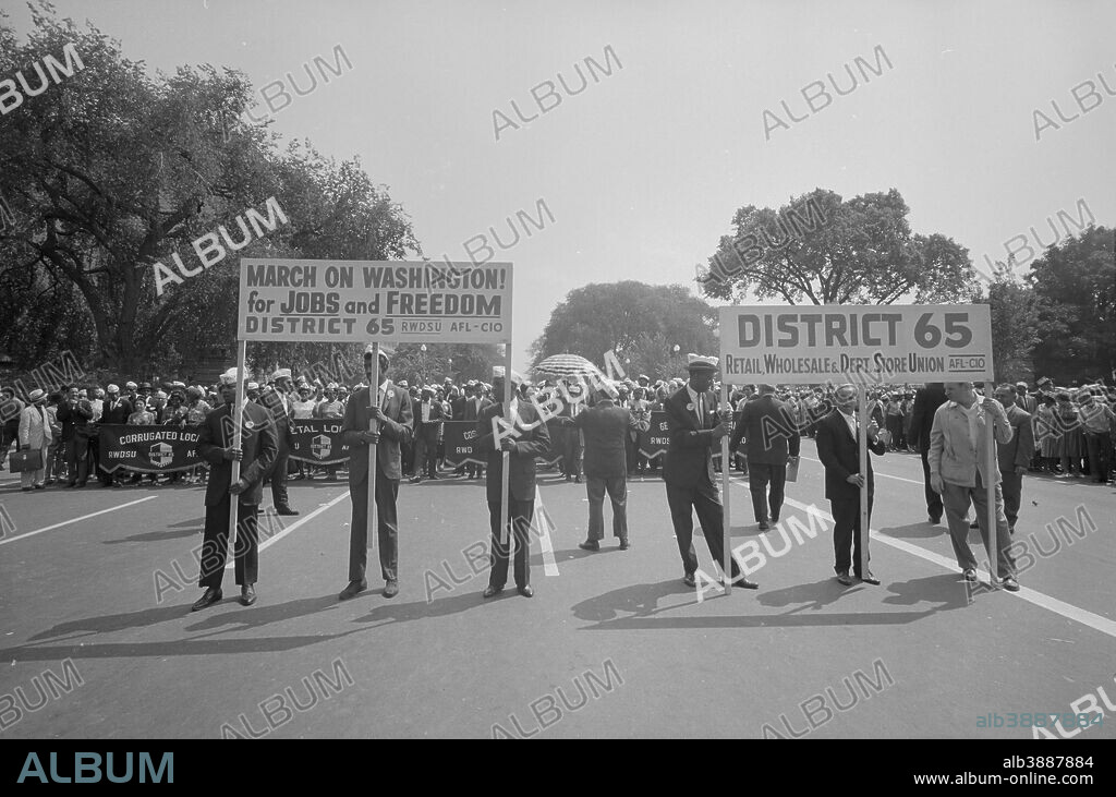 August 28, 1963 - Marchers carrying District 65 sign at the March on Washington during the civil rights movement.