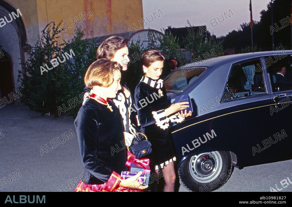 Princess Gloria von Thurn and Taxis with daughters Maria Theresia and Elisabeth at the wedding of Princess Alexandra zu Sayn Wittgenstein Sayn and Prince Carl Eugen zu Oettingen and Wallerstein at Bendorf, Germany 1994.