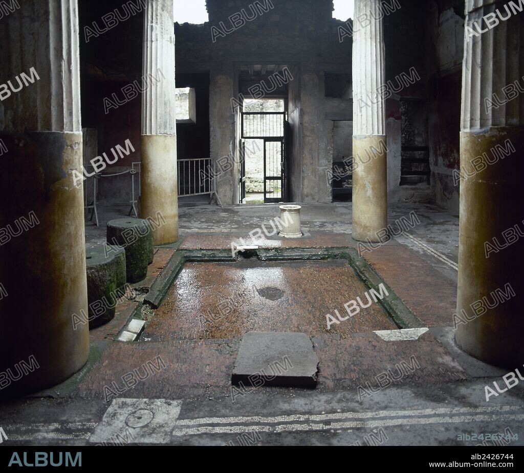 Italy. Pompeii. House of Lucius  Ceius Secondus or House of the Ceii. 1st century a.C. Tetrastyle atrium and the Impluvium, designed to collect the rainwater coming from the compluvium in the roof. Way of Abundance.